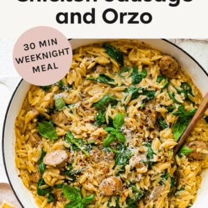 Skillet with a chicken sausage, spinach and orzo one pan dinner.