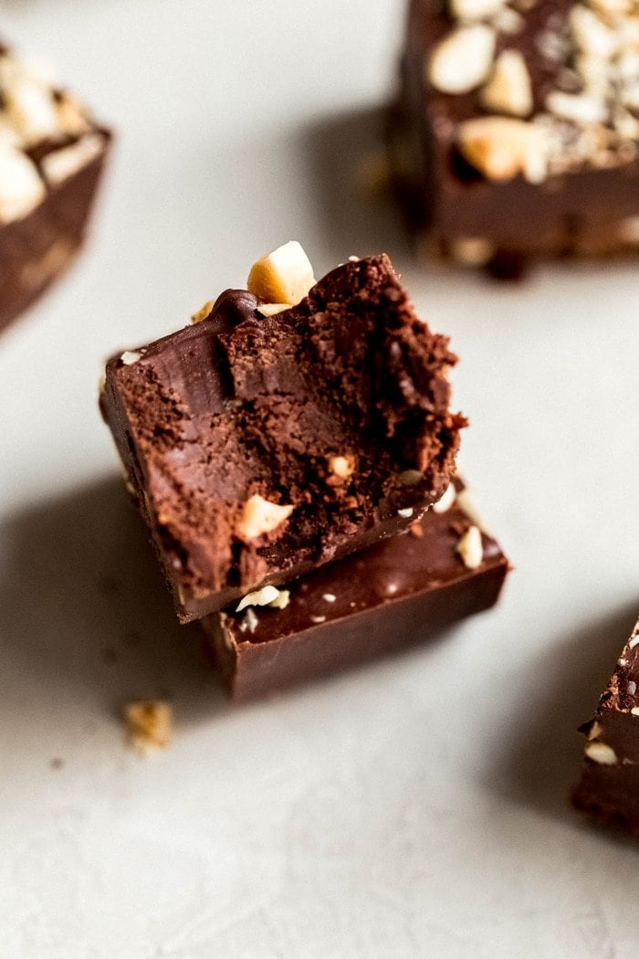 Piece of fudge has a bite taken out of it.