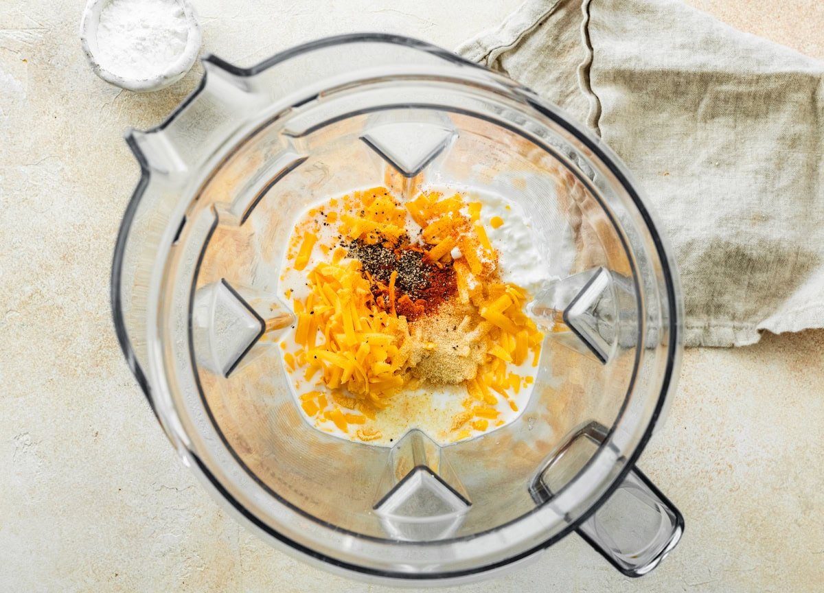 cottage cheese, milk, cheddar cheese, arrowroot powder, and spices in a blender.