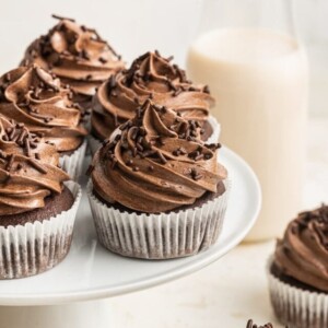 Healthy chocolate cupcakes displayed on a cake stand.