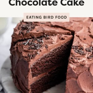 Healthy Chocolate Cake with a slice cut from it, showing the layers inside.