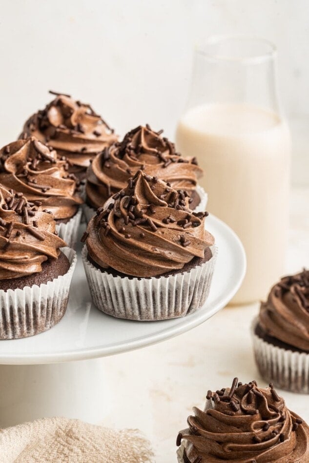 Healthy chocolate cupcakes displayed on a cake stand.