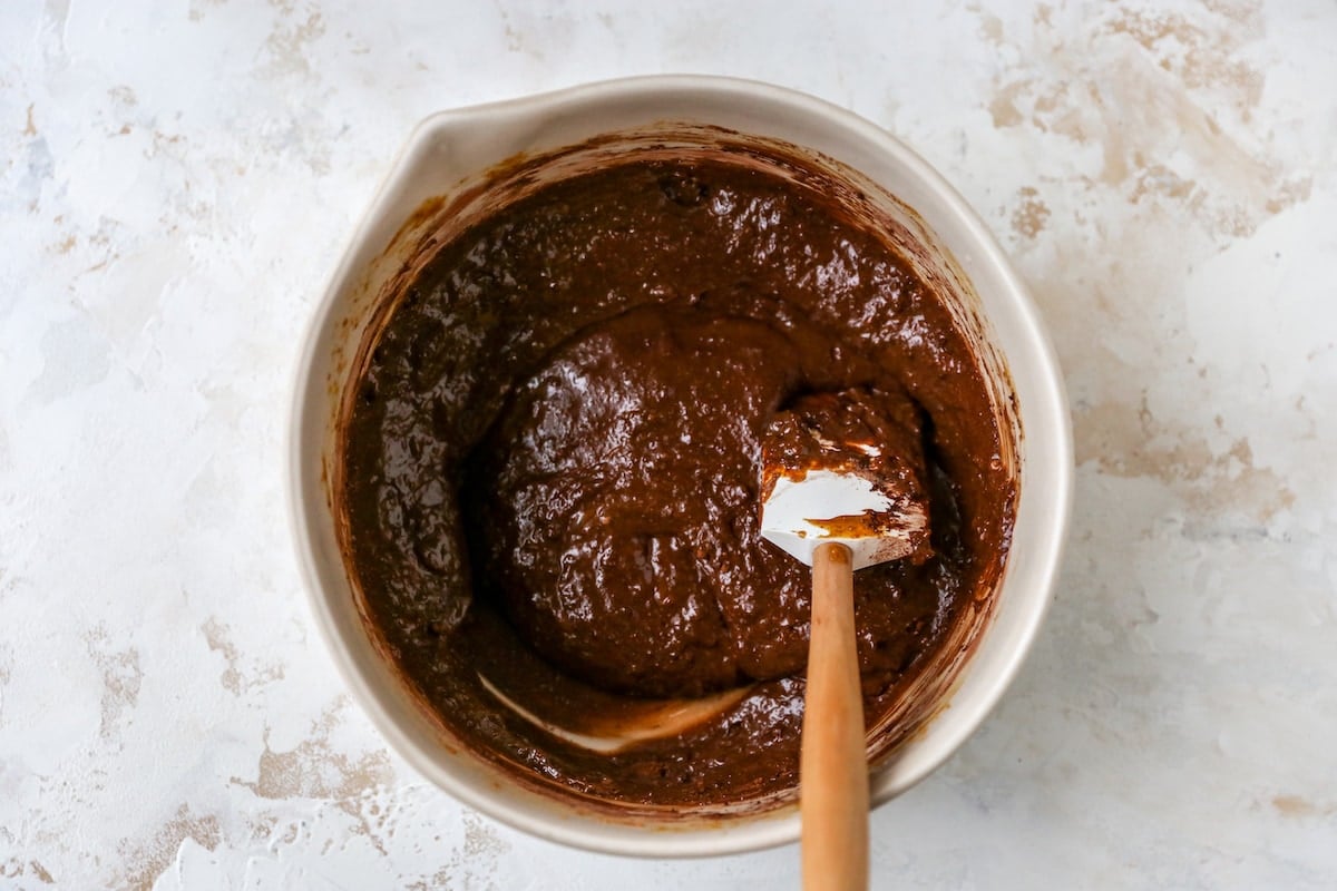 The wet and dry ingredients incorporated together with a spatula.