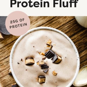 Bowl of Peanut Butter Protein Fluff topped with a chopped peanut butter cup.
