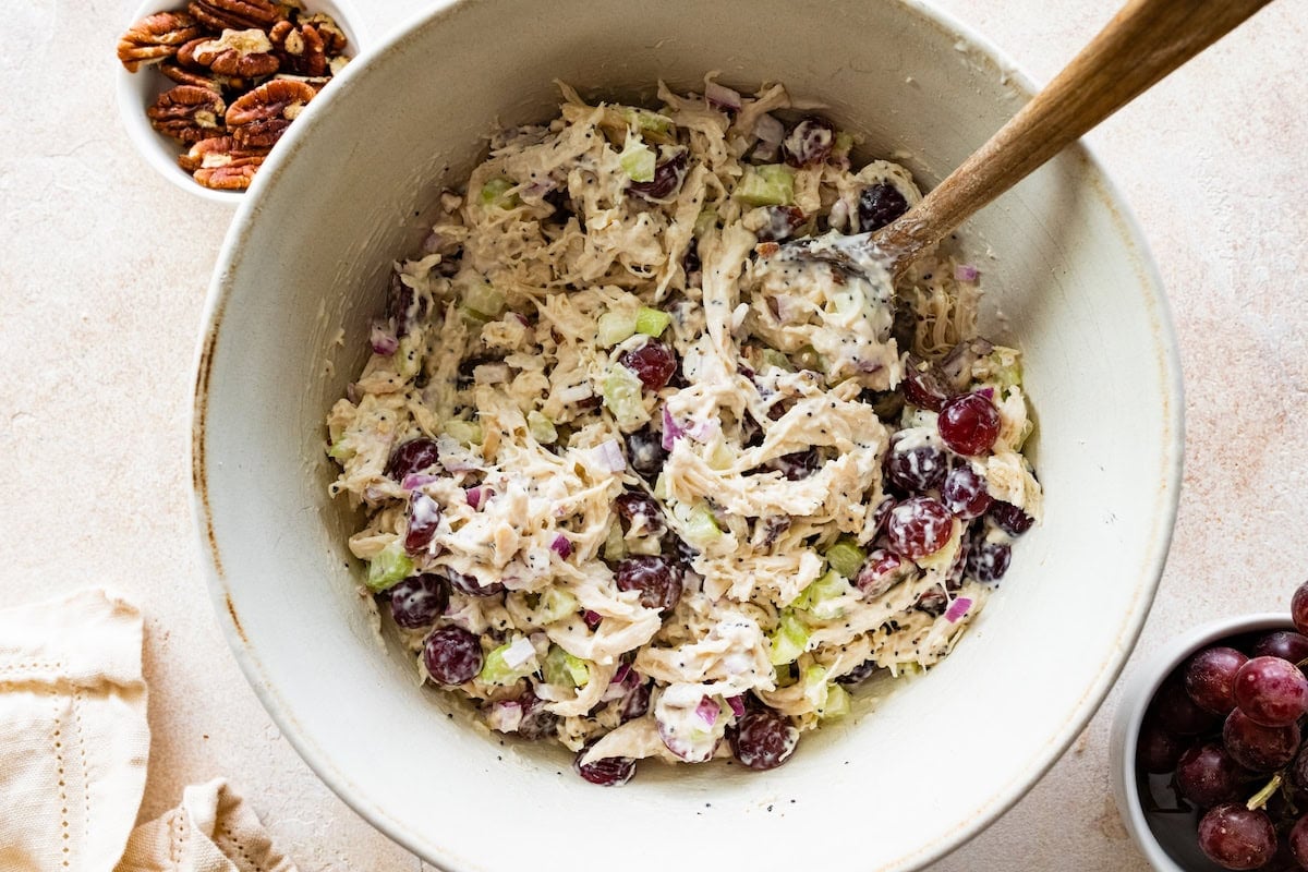 The mixed sonoma chicken salad in a white mixing bowl.