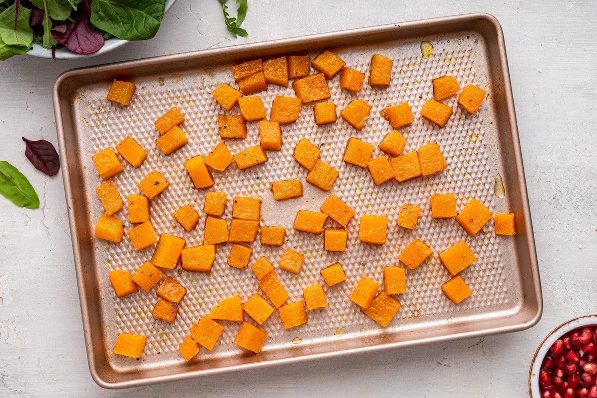Roasted butternut squash on a baking sheet/